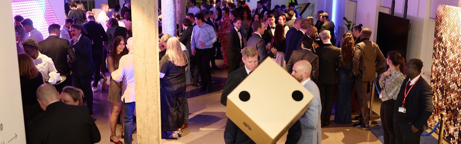 Guests celebrating around casino tables in an elegant venue