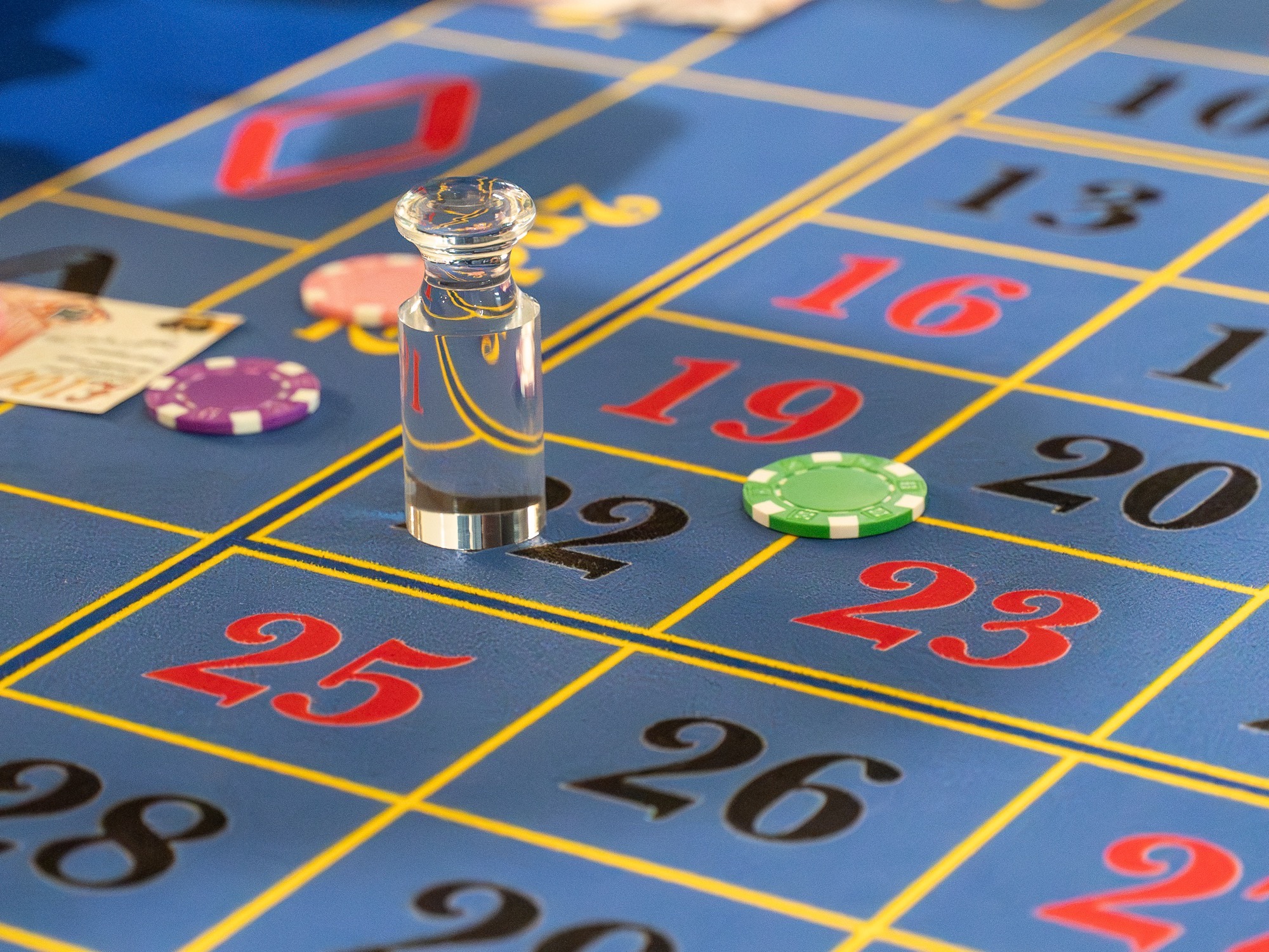 A crystal dolly and chips on a Royale roulette layout