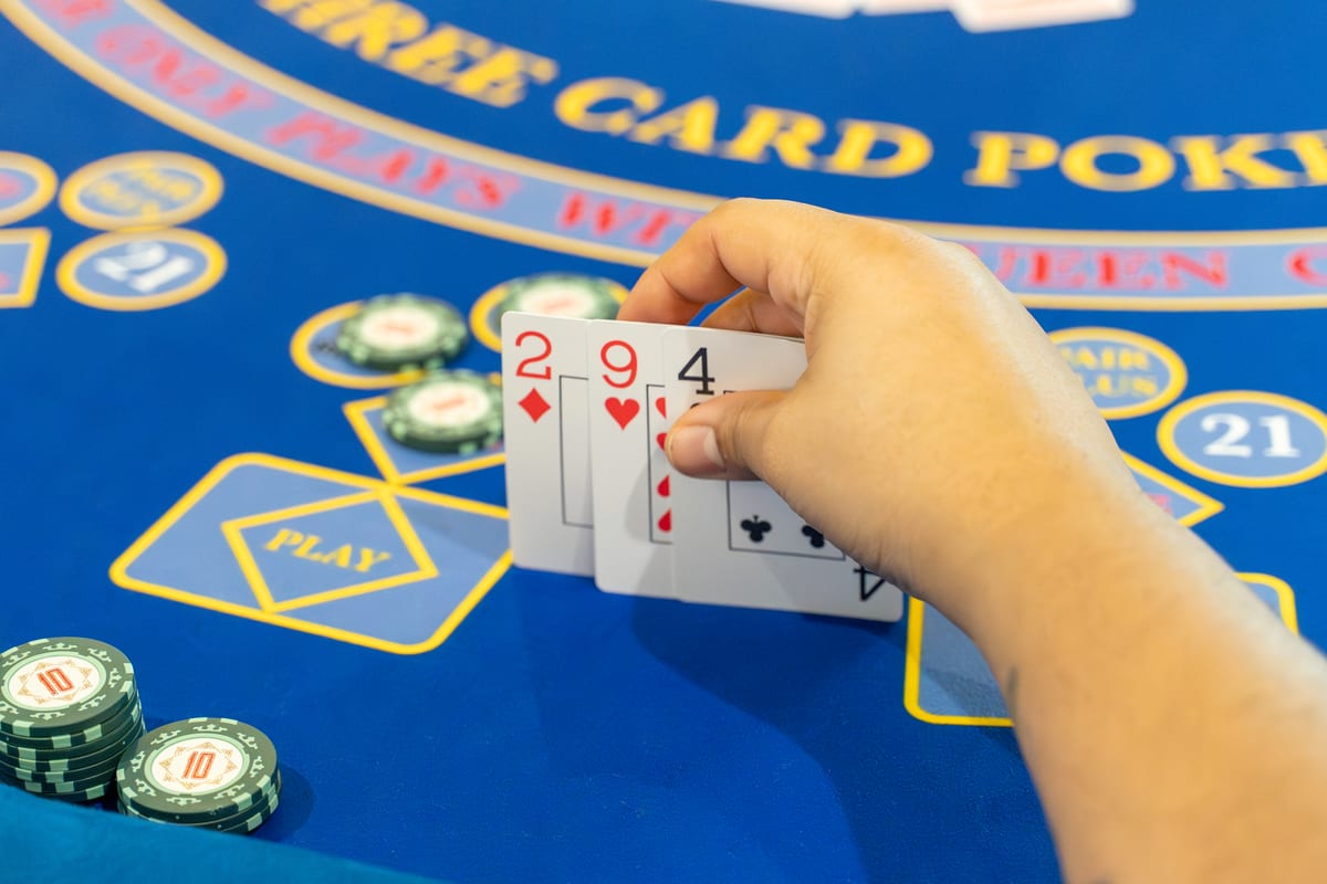Two guests concentrating on their hands at Three Card Poker