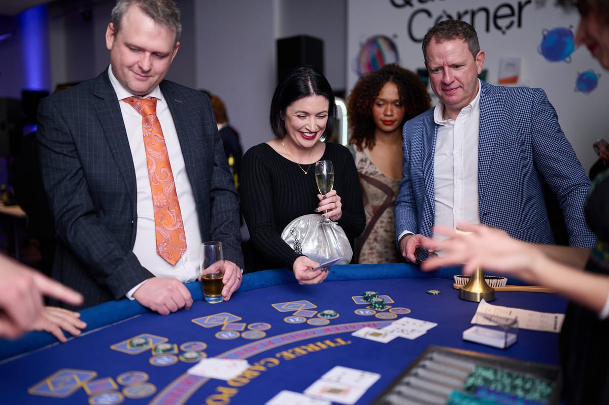 Guests at the Three Card Poker table at a corporate party