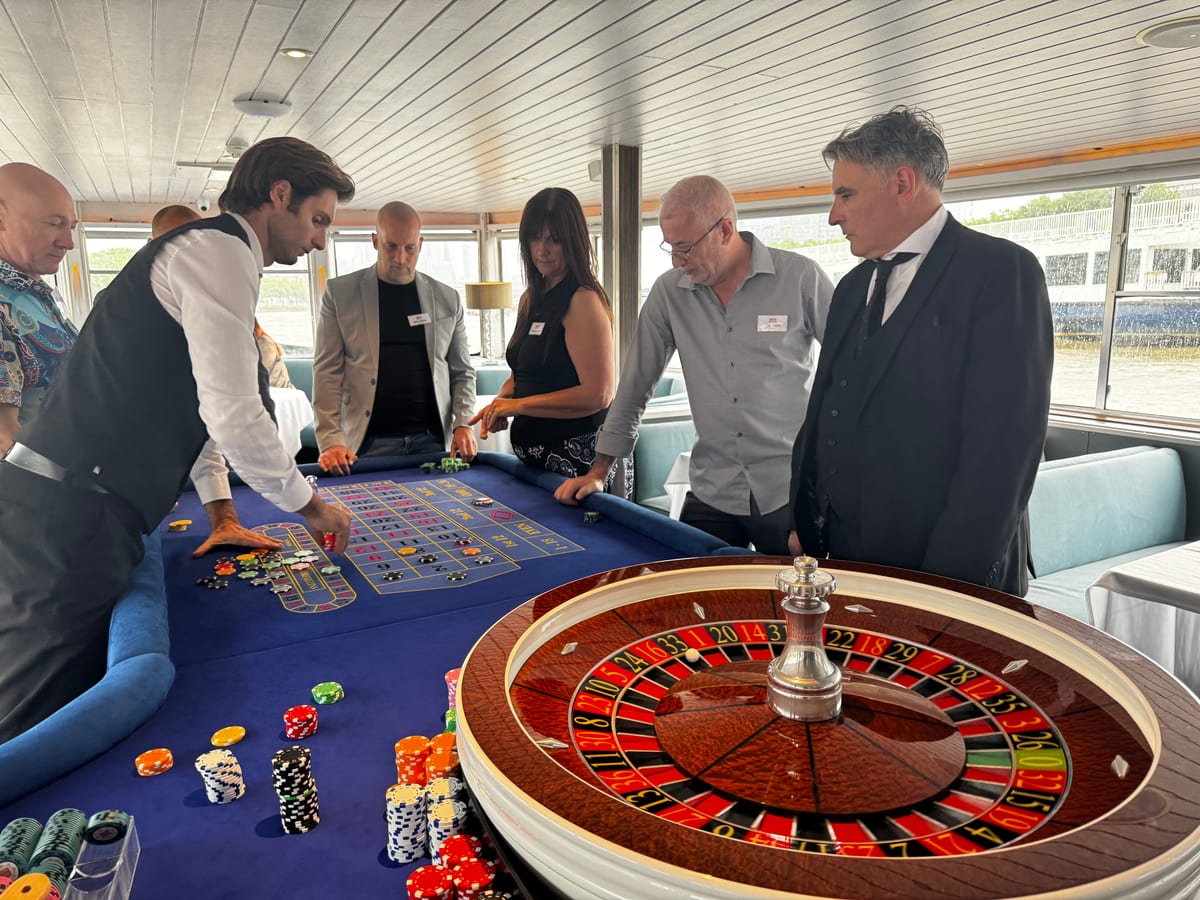 Guests playing roulette on board a Thames boat