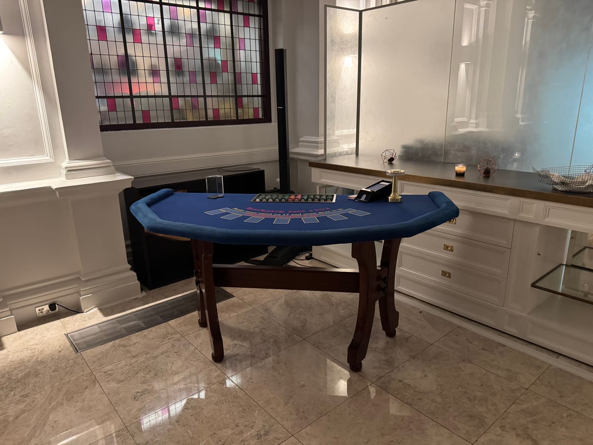 A blackjack table set up and ready in a white function room