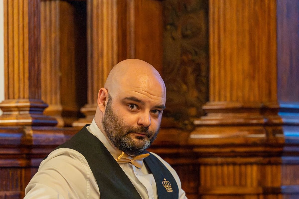 One of our croupiers at the table in an oak-panelled hall